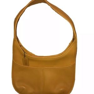 Yellow leather Coach bag. New but no tags